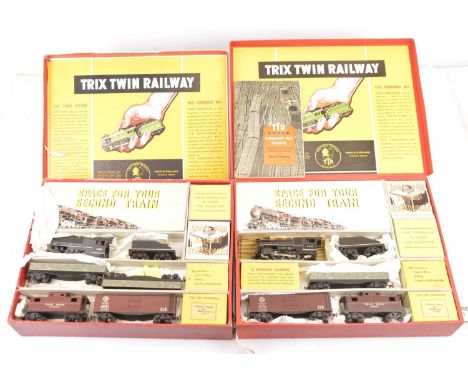A pair of Trix (TTR) 00 Gauge 3-rail 14v AC American Freight Train Packs (2), ref 9/320, with 'switcher' loco 3747 and slope-