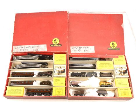 A pair of Trix (TTR) 00 Gauge 3-rail 14v AC LMS Train Sets, Goods Set 2/324 with plain black 0-4-0 loco 8032 (dated F,0), wit
