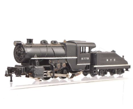 An uncommon Trix 00 Gauge 12v DC kit-built American 'Switcher' Locomotive and Tender, incorporating the unique additional red