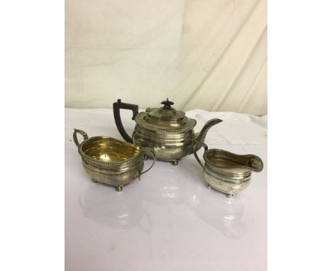 A HM silver three-piece tea service by the Goldsmith & Silversmith Co (kettle A/F)