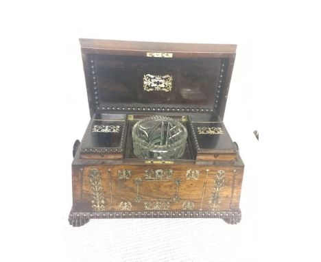 A 19th century rosewood tea caddy inlaid with mother of pearl, opening to reveal two rosewood canisters and a mixing bowl on 
