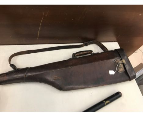 A vintage leather leg o' mutton shotgun case