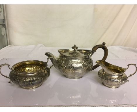 A HM silver Georgian teapot by RU and SU; together with a Victorian HM silver sucrier and creamer