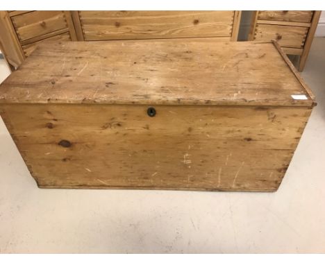A large antique pine trunk with candle box