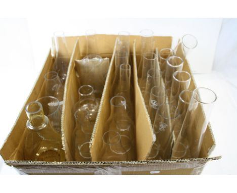 A collection of over 25 oil lamp glass chimneys. 