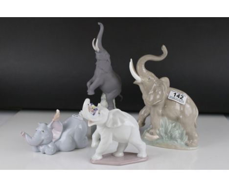 Lladro Bisque Elephant together with another Lladro Elephant and Two Nao Elephants, tallest 27cms 