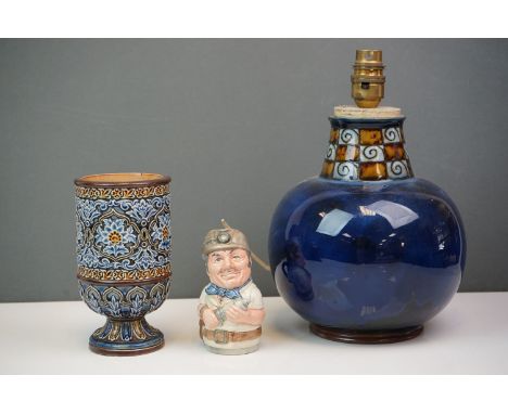 A Doulton blue ground table lamp together with a Doulton Lambeth footed vase decorator  M A and a small character jug The Mis