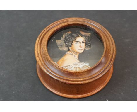 A Portrait miniature mounted in a wooden box. 