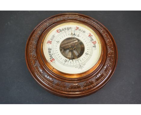 A early 20th century circular wall hanging barometer. 