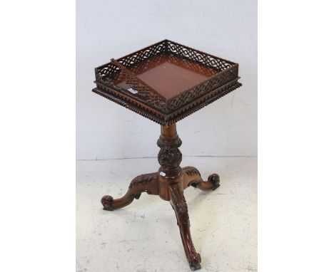 Square Lamp Table in the Chippendale manner with fretwork gallery and raised on a column support with three carved splayed le