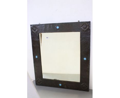 In the manner of Liberty's of London, Arts and Crafts Rectangular Wall Mirror, the hammered Pewter frame with embossed roses 