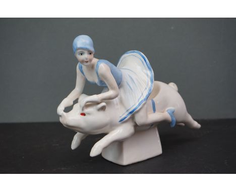 Ceramic Art Deco style figure of a lady riding a pig 
