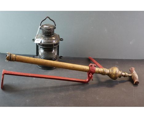 A mid 20th century Matts Head patt 4118 G Bocock and Co 1943 ships lamp together with a vintage stirrup pump marked Four Oaks