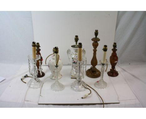 A collection of nine vintage table lamps to include glass, wood and ceramic examples. 