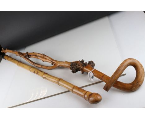 South East Asian Bamboo Walking Stick with Butterfly and Flowers decoration together with Knotted Root Walking Stick 