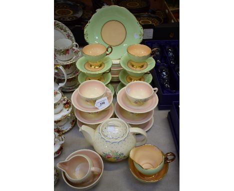 A Susie Cooper Printemps pattern six setting tea set, including teapot, sugar bowl, milk jug, salad plates, cake plates and s