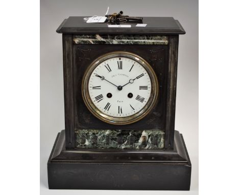 A Victorian black slate chiming mantel clock, J &amp; G Haywood, Paris, circular dial, Roman numerals, twin winding holes, 29