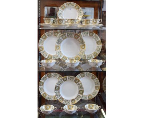 A Royal Crown Derby Green Derby Panel pattern part dinner service, including dinner plates, bread and butter plates, cups and