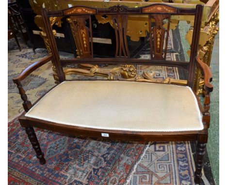 An Edwardian mahogany and marquetry sofa/bench, shaped cresting rail inlaid with flowerheads, the outer splats inlaid with ri