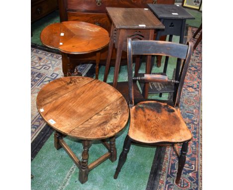 An unusual early 20th century oak occasional table, trefoil shaped top with fall leaves, outswept ring turned legs congregate