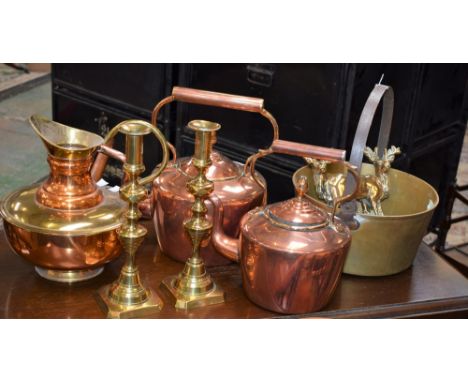 A Victorian copper kettle, acorn finial, 30.5cm high; another smaller, maker's mark A&amp;L; a pair of Victorian brass candle