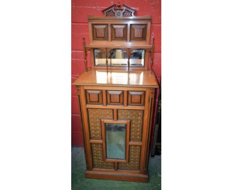 An Aesthetic Movement walnut side cabinet, in the manner of Bruce Talbert (1838-1881), break-arch cresting above a shelf and 