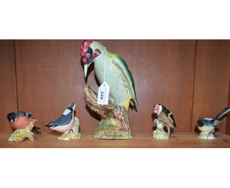 A large Beswick model, of a Woodpecker, no1218; other smaller Beswick models, Nuthatch, 2413, Grey Wagtail, 1041, Goldfinch, 