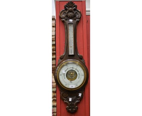 A late Victorian carved oak wheel barometer, Dolland, London, no52598, approx 87cm high