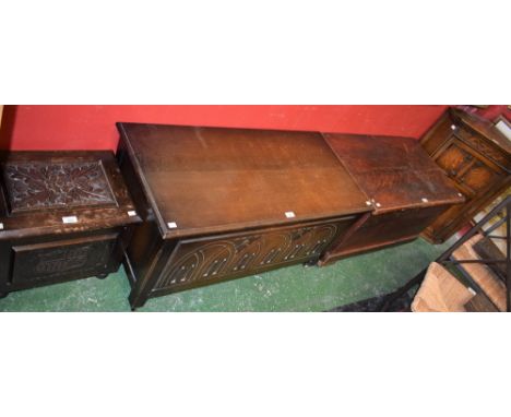 An oak blanket chest, Gothic style architectural front panel; a similar wall hanging corner cupboard and log box; another bla