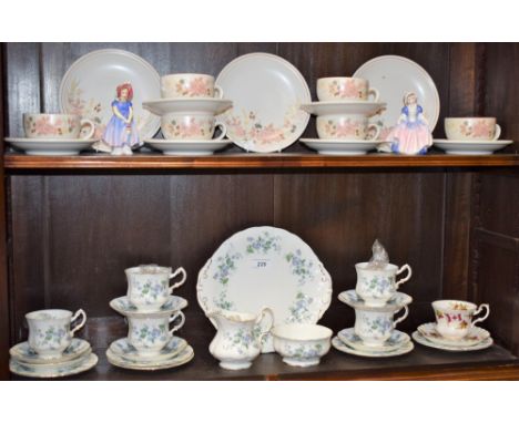 A Paragon Forget Me Not pattern part tea service, comprising cups, saucers, side plates, bread and butter plate, milk jug and