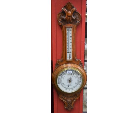 A Victorian oak barometer mercury thermometer, carved with leafy scrolls, 88cm high, c.1870