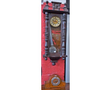 An oak Vienna wall clock, circular enamel dial with bold Roman numerals, subsidiary seconds dial, twin winding holes, approx 