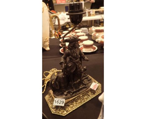 Spelter figural lamp on a good cast brass base