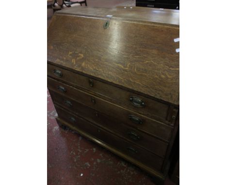 A 19th Century oak bureau with four long drawers on bracket feet 103cm high, 103cm wide 