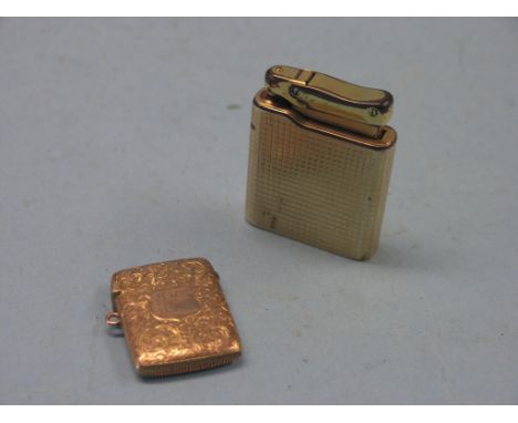 A 9ct. engraved gold vesta case, 12.4 grams and a 9ct. gold cigarette lighter