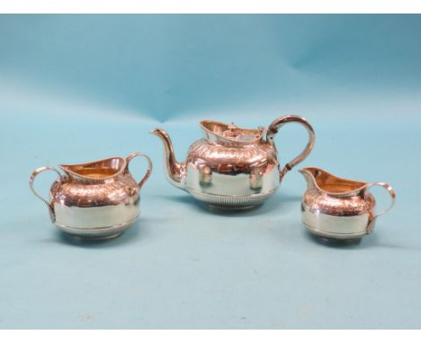 A good, late Victorian silver teaset, teapot, two-handled sugar bowl and milk jug, embossed shoulders, Sheffield 1898-99, app