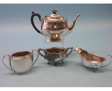 A silver teapot, Birmingham 1921, silver sugar bowl and sauce jug and an imported silver sugar bowl, approx. 35oz. gross tota