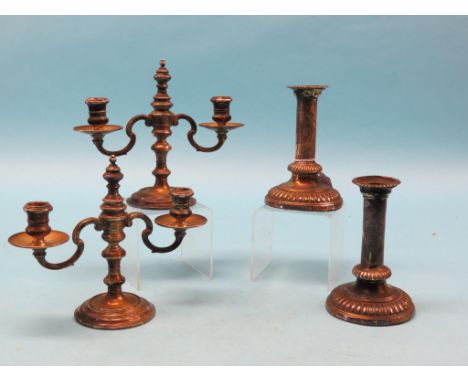 A pair of silver twin-sconce candelabra, London 1938, approx. 31oz. total, and a pair of George III silver candlesticks, tubu
