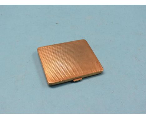 An engine-turned 9ct. gold cigarette case, Birmingham 1929, 68.9 grams