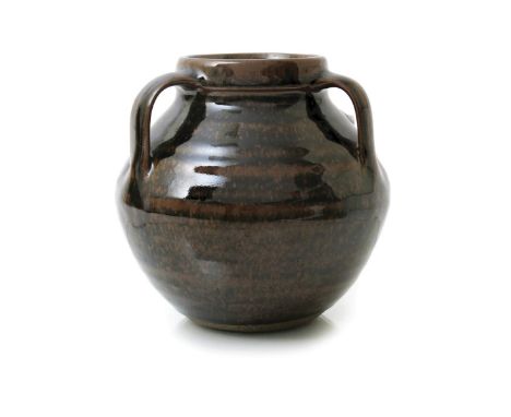 ‡ Geoffrey Whiting (1919-1988) an Avoncroft pottery stoneware vase, three handled vase covered in a tenmoku glaze, impressed 