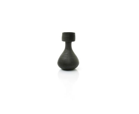 ‡ Hans Coper (1920-1981) a stoneware vase, tapering pear shape with cylindrical neck, covered in a black glaze, impressed sea