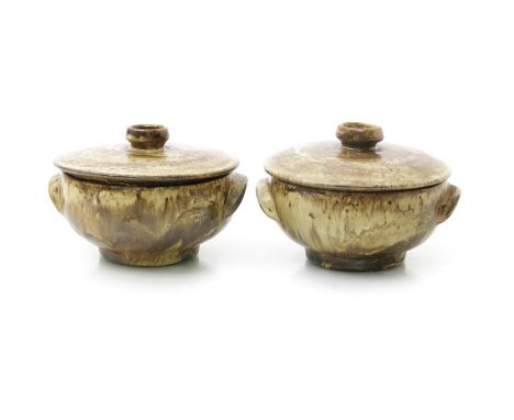 ‡ Dame Lucie Rie DBE (1902-1995) a pair of early earthenware twin-handled pot and covers, covered in a running speckled buff 