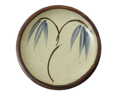 ‡ Bernard Leach (1887-1979) a St Ives Pottery plate, painted to the well with a simple willow tree motif, in blue and tenmoku