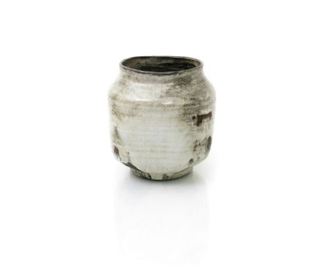 ‡ Dame Lucie Rie DBE (1902-1995) an early earthenware vase, shouldered square section, covered in an off white glaze with exp