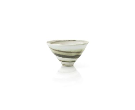 ‡ Dame Lucie Rie DBE (1902-1995) a flaring porcelain conical bowl, pale off white glaze with painted ochre swirl to inside an