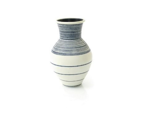 ‡ Julian Stair (born 1955) a porcelain vase, shouldered form with cylindrical neck, white with irregular incised bands with c