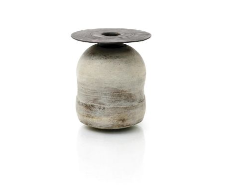 ‡ Hans Coper (1920-1981) a stoneware vase,, the body with subtle impressed panels, glazed with iron manganese to rim and whit