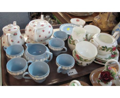 Tray of assorted china to include: Wedgwood blue and white tea cups and saucers; Royal Doulton Rose design teapot, sucrier et