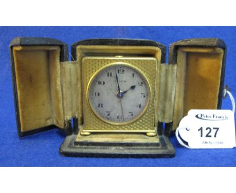 Early 20th Century Zenith engine turned, gilt metal alarm clock with silvered face and having original leather case with two 
