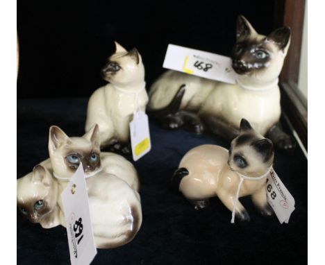 Group of four china cat and kitten studies to include: Royal Doulton and West Germany Goebel. (4)
